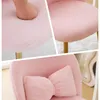 Collage of a pink fluffy chair, highlighting its softness and a bow-shaped pillow. Podgląd zdjęcia produktu