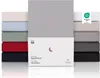 A stack of folded fitted sheets in various colors, with a product box in the foreground. Anteprima dell’immagine prodotto