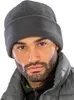 A close-up portrait of a man wearing a gray fleece hat and jacket. Produktbild-Vorschau
