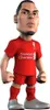 A cartoon-like figurine of a soccer player in a red Liverpool FC uniform. Anteprima dell’immagine prodotto