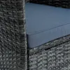 A close-up view of a grey poly-rattan chair with a blue cushion. Produktbild-Vorschau