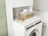 A laundry room with a washing machine and a cabinet above it. Produktbild-Vorschau