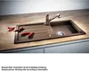 A kitchen sink with a faucet and chili peppers on the countertop. Anteprima dell’immagine prodotto