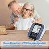An elderly couple is shown with a blood pressure monitor on a table. Produktbild-Vorschau