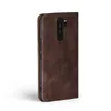 A brown flip cover case for a smartphone is shown from the side against a white background. Produktbild-Vorschau