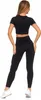 A woman is shown from the back wearing black leggings and a black crop top. Produktbild-Vorschau