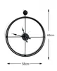 A black metal wall clock is shown against a white background with dimensions indicated. Podgląd zdjęcia produktu