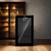 A wine cooler is shown in a room with a wooden cabinet and a textured wall. Produktbild-Vorschau