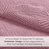 Close-up of a pink knitted blanket with text overlay. Produktbild-Vorschau