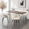 A dining room setting with a table and chairs. Produktbild-Vorschau