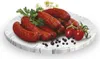 A plate of sausages with tomatoes and herbs. Produktbild-Vorschau