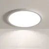 A round, flat LED ceiling light mounted on a white ceiling, casting a soft light downwards. Produktbild-Vorschau