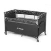 A travel crib with a black fabric body and a white teddy bear pattern on the top edge. Náhled obrázku produktu