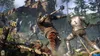 Knights in armor fighting in a forest with a ruined castle in the background. Produktbild-Vorschau
