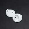 Two white silicone earbud tips on a black textured surface. Produktbild-Vorschau
