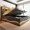A modern upholstered bed with its storage compartment open, revealing stored items and illuminated by LED lighting. Náhľad obrázku produktu