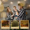 A family with a baby in a kitchen, with three inset images showing different decorative lighting applications. Produktbild-Vorschau