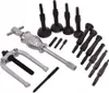 A set of automotive tools, specifically bearing pullers and slide hammers, laid out on a white background. Voir les images du produit