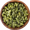A top-down view of shelled pistachios in a wooden bowl. Produktbild-Vorschau