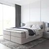 A bedroom scene with a bed and bedside tables. Produktbild-Vorschau