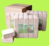 A stack of firewood briquettes in front of an open cardboard box. Produktbild-Vorschau