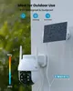 A white outdoor security camera with a solar panel attached to a wall, with rain and snow effects overlaid. Náhled obrázku produktu