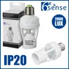 Product packaging and two motion sensor lamp holders are shown against a white background. Text and logos are overlaid. Produktbild-Vorschau