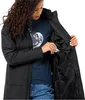 A woman is shown putting items into the inner pocket of a black jacket. Produktbild-Vorschau