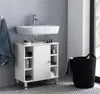 A bathroom scene featuring a white sink cabinet with shelves and a door, a white sink with a faucet, and a black laundry basket. Náhled obrázku produktu