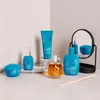 A collection of Alfaparf Milano Semi Di Lino hair care products arranged on a light gray and white surface, with a mirror in the background. Produktbild-Vorschau