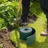 A person is using a shovel to dig a trench in a garden, next to a roll of green garden edging. Produktbild-Vorschau