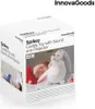 The image shows the product packaging for a cuddly toy with sound and projector, with a child sleeping in the background. Voir les images du produit