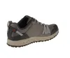 A side view of a single gray athletic shoe against a white background. Voir les images du produit