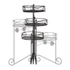 A three-tiered metal plant stand with a black finish, shown against a white background. The stand has decorative scrollwork and leaf motifs. Náhľad obrázku produktu