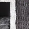 A close-up view of the textured fabric and fluffy trim of a cat scratching post. Produktbild-Vorschau