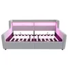 A light gray upholstered bed frame with a slatted base and integrated LED lighting in pink. Voir les images du produit