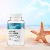 A bottle of OstroVit Marine Collagen supplement sits on a sandy beach next to a starfish, with the ocean and sky in the background. Náhľad obrázku produktu