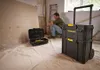A man is working on a construction site with tools. Voir les images du produit