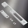 A set of metal door hardware components, including a strike plate, a latch, and screws, laid out on a gradient background. Podgląd zdjęcia produktu