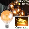 A collage of images showing vintage-style LED light bulbs, including a close-up of one bulb and a group of them hanging, with marketing text and a logo. Produktbild-Vorschau