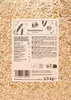 A close-up of a bag of Dinkel Flocken (spelt flakes) with a label showing nutritional information and ingredients in multiple languages. Produktbild-Vorschau