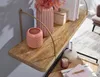 A close-up shot of a wooden shelf with decorative items. Podgląd zdjęcia produktu