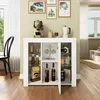 A white cabinet with various items on display, including coffee maker, bottles, and glassware, in a well-lit room. Podgląd zdjęcia produktu
