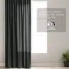 A dark gray velvet curtain is shown hanging on the left side of the image, covering most of a window. A graphic overlay on the right side of the image provides information about the curtain's room-darkening capabilities. Produktbild-Vorschau