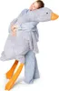 A person hugging a large stuffed goose. Náhľad obrázku produktu