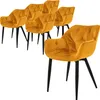 A set of six mustard yellow velvet dining chairs with black legs, arranged on a white background. Náhled obrázku produktu
