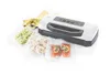 A vacuum sealer with various food items sealed in plastic bags. Náhľad obrázku produktu