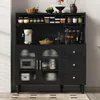 A black kitchen cabinet with glass doors and drawers, filled with kitchenware and decorative items. Podgląd zdjęcia produktu