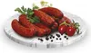 A plate of sausages with tomatoes and herbs. Náhled obrázku produktu