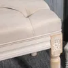 Close-up of the upholstered bench leg and tufted seat. Anteprima dell’immagine prodotto